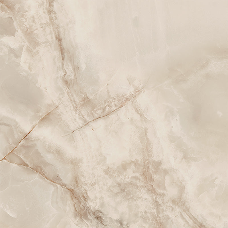 Close-up of Hashim Ivory Honed Matt Onyx 60x60cm porcelain tile featuring soft ivory onyx-effect veining with warm cream, beige and subtle golden tones. The honed matt finish creates a luxurious natural stone look, ideal for bathroom walls, feature walls and elegant interior spaces.