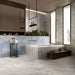 Luxury bathroom featuring Hashim White Honed Matt Onyx porcelain tiles on the walls, bath surround and floor. The soft white onyx-effect veining creates a bright, spa-inspired interior, complemented by warm wood cabinetry, black accents and large-format tiles for a seamless contemporary finish.