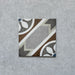 Single tile from the Carnaby Heythrop Victorian-style collection, 20x20cm porcelain wall and floor tile, featuring a geometric floral pattern in taupe, terracotta, grey, and blue on a softly aged background.