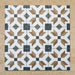 Grouped layout of Carnaby High Street Victorian-style 20x20cm porcelain wall and floor tiles, showing the full repeating star-shaped geometric pattern in mustard, olive, brown, white, and charcoal tones.