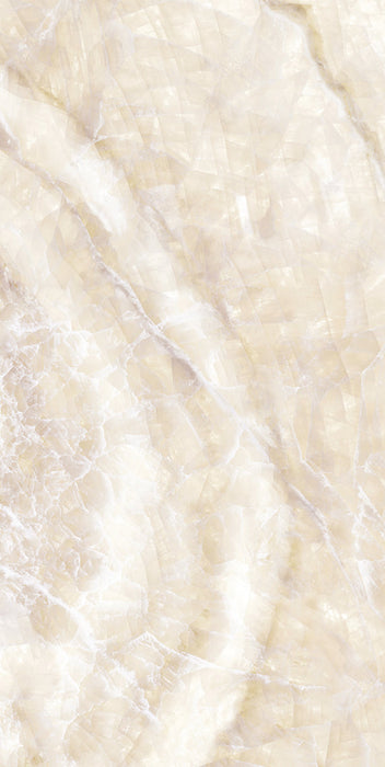 Close-up of Illuminati Precious Stone Ivory 60 × 120cm polished porcelain tiles, featuring soft ivory and cream gemstone-inspired tones with delicate veining, luminous detailing, and a refined high-gloss natural stone effect finish.