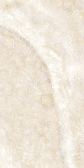 Close-up of Illuminati Precious Stone Ivory 60 × 120cm polished porcelain tiles, featuring soft ivory and cream gemstone-inspired tones with delicate veining, luminous detailing, and a refined high-gloss natural stone effect finish.