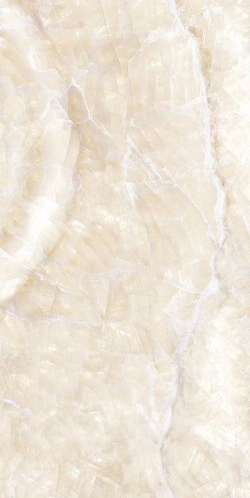 Close-up of Illuminati Precious Stone Ivory 60 × 120cm polished porcelain tiles, featuring soft ivory and cream gemstone-inspired tones with delicate veining, luminous detailing, and a refined high-gloss natural stone effect finish.
