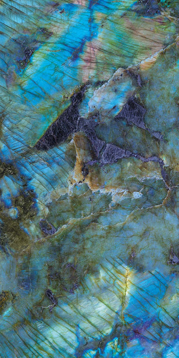 Close-up of Illuminati Precious Stone Labradorite 60 × 120cm polished porcelain tiles, featuring dramatic blue, charcoal, and iridescent gemstone-inspired veining with a high-gloss finish and striking natural stone effect detailing.