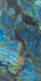 Close-up of Illuminati Precious Stone Labradorite 60 × 120cm polished porcelain tiles, featuring dramatic blue, charcoal, and iridescent gemstone-inspired veining with a high-gloss finish and striking natural stone effect detailing.