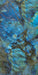 Close-up of Illuminati Precious Stone Labradorite 60 × 120cm polished porcelain tiles, featuring dramatic blue, charcoal, and iridescent gemstone-inspired veining with a high-gloss finish and striking natural stone effect detailing.