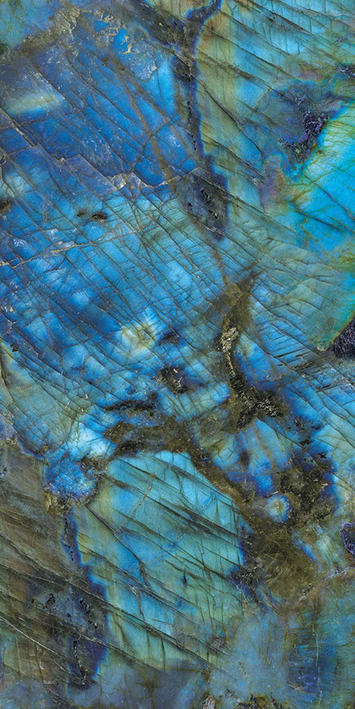 Close-up of Illuminati Precious Stone Labradorite 60 × 120cm polished porcelain tiles, featuring dramatic blue, charcoal, and iridescent gemstone-inspired veining with a high-gloss finish and striking natural stone effect detailing.