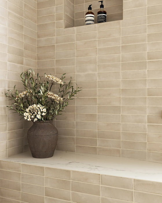 Bathroom featuring Atlas Canvas Mini Brick 5x15cm matt wall tiles, installed in a stacked layout, showcasing soft neutral tones with a subtle textured finish, paired with brass fittings and a calm, contemporary interior setting.