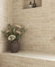 Bathroom featuring Atlas Canvas Mini Brick 5x15cm matt wall tiles, installed in a stacked layout, showcasing soft neutral tones with a subtle textured finish, paired with brass fittings and a calm, contemporary interior setting.