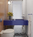 Bathroom setting featuring Noventa Terrazzo Nero 59x59cm matt porcelain wall and floor tiles, showcasing a bold terrazzo effect with crisp white stone fragments set against a deep black base, carried across both floor and stepped detailing, paired with warm wood panelling and a striking cobalt vanity for a contemporary, design-led finish.