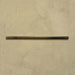 Izmir Daisy Green Gloss Pencil Bullnose Border Tile 1.2x30cm displayed on a textured beige background, showing its slim rounded edge and smooth glossy finish.