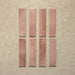 Izmir Brick Tusk Rose Gloss 6x25cm — individual tile set. Each piece showcases delicate tonal variation and a soft pinkish blush hue, enhanced by a glossy, handcrafted surface. Ideal for adding warmth and personality to kitchens, bathrooms, and feature walls.
