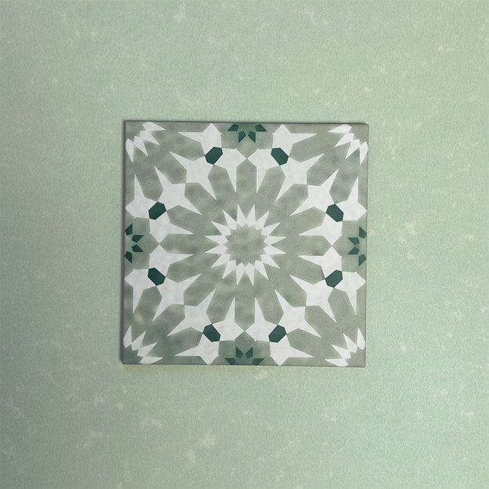 Fizaan Jade Green Moroccan-style 20×20cm porcelain tile featuring a soft green and white geometric star pattern.