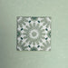 Fizaan Jade Green Moroccan-style 20×20cm porcelain tile featuring a soft green and white geometric star pattern.