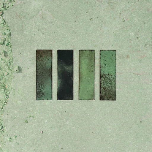 Close-up of Fusion Bricks Jade Green 6.5x20cm brick wall tiles, showcasing rich green tones with tonal variation and a lightly textured surface, highlighting a natural, handcrafted look.
