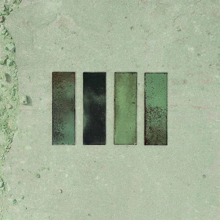 Close-up of Fusion Bricks Jade Green 6.5x20cm brick wall tiles, showcasing rich green tones with tonal variation and a lightly textured surface, highlighting a natural, handcrafted look.