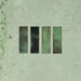 Close-up of Fusion Bricks Jade Green 6.5x20cm brick wall tiles, showcasing rich green tones with tonal variation and a lightly textured surface, highlighting a natural, handcrafted look.
