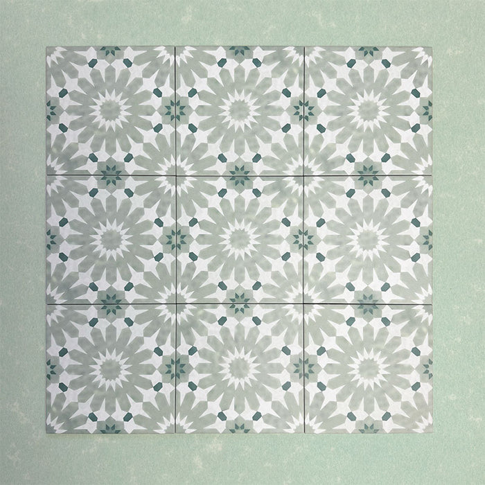 Fizaan Jade Green Moroccan-style 20×20cm porcelain tile featuring a soft green and white geometric star pattern.