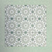 Fizaan Jade Green Moroccan-style 20×20cm porcelain tile featuring a soft green and white geometric star pattern.
