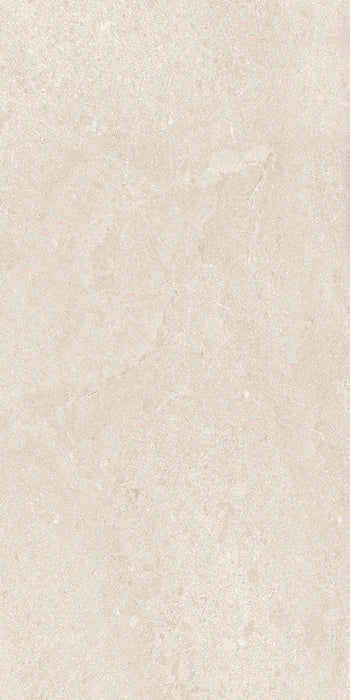 Close-up of Jeddah Avorio Neutra Stone 30x60cm stone-effect wall and floor tile, featuring warm ivory and beige tones with delicate natural stone-inspired veining and a subtle, elegant textured finish.