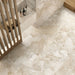 Interior featuring Jeddah Avorio Sassi Terrazzo Stone 60x120cm stone-effect wall and floor tiles, showcasing warm ivory and beige tones with natural stone-inspired detailing, styled with a walk-in shower, timber accents and contemporary finishes.