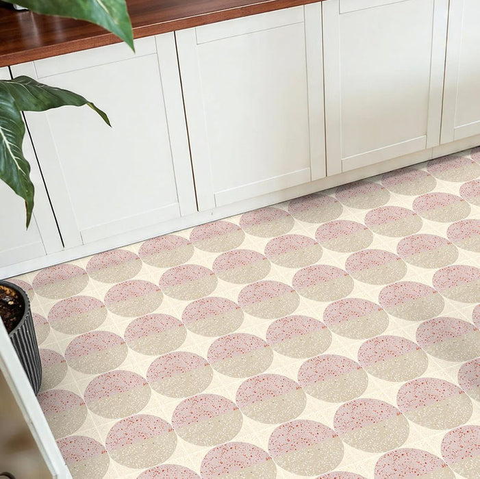 Kitchen featuring Kasuf Rose 20x20cm terrazzo-style decor floor tiles, styled with soft pink and neutral tones, warm wood worktops, and classic shaker cabinetry for a playful contemporary interior.