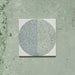 Kasuf Verde 20x20cm terrazzo-style decor tiles featuring a soft sage green and pale blue circular pattern with speckled terrazzo detailing, perfect for creating calming geometric floors and contemporary statement interiors.