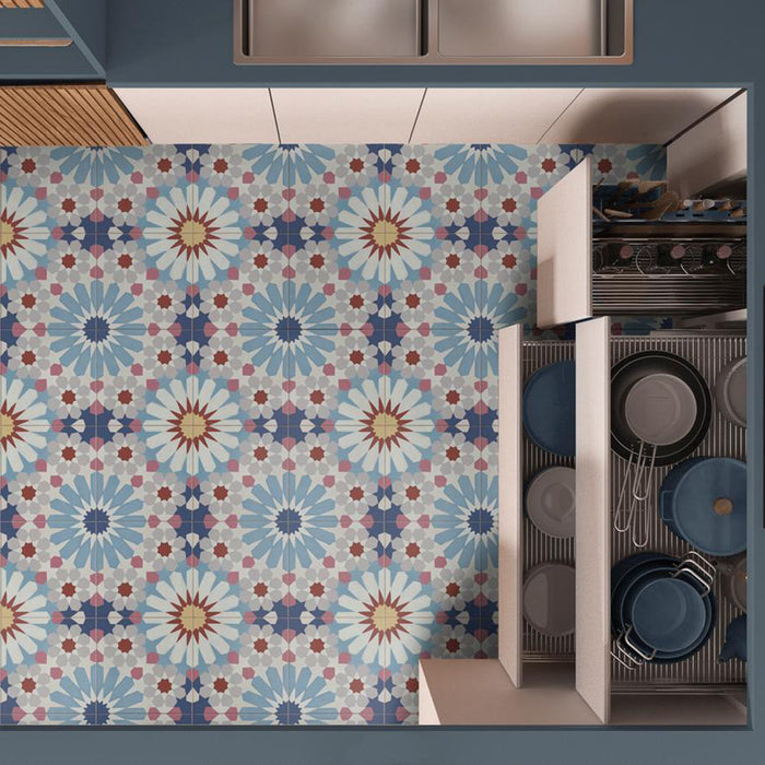 Kitchen featuring Fizaan Fiera 20x20cm Moroccan-style porcelain floor tiles, showcasing a bold geometric pattern in soft blue, red and neutral tones, styled with modern cabinetry.