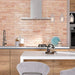 Izmir Brick Tusk Rose Gloss 6x25cm — shown in a contemporary kitchen setting. These blush-toned brick tiles feature a glossy handcrafted finish that reflects light beautifully, adding warmth and character to modern and rustic spaces alike. Perfect for creating an inviting statement splashback.