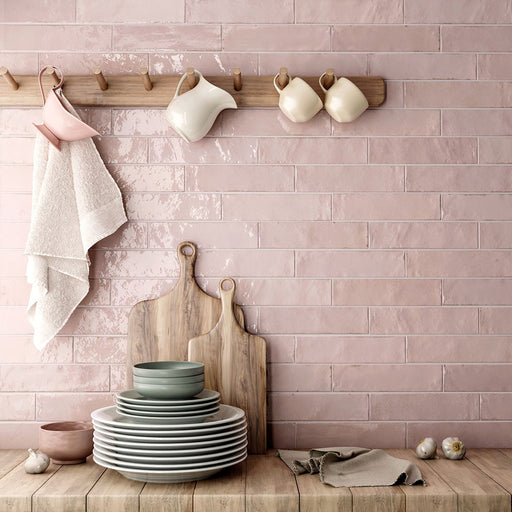 Madison Rose Brick Wall Tiles 6x24.6cm — kitchen setting showcasing the soft blush tones and handcrafted texture. The glossy finish reflects light beautifully, creating a warm and inviting backdrop perfect for adding a gentle touch of colour to contemporary or rustic interiors.