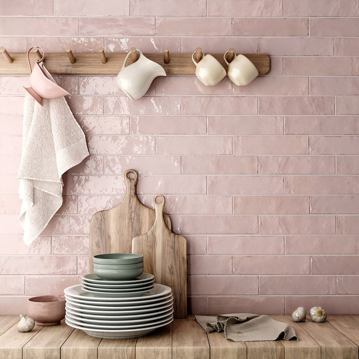 Madison Rose Brick Wall Tiles 6x24.6cm — kitchen setting showcasing the soft blush tones and handcrafted texture. The glossy finish reflects light beautifully, creating a warm and inviting backdrop perfect for adding a gentle touch of colour to contemporary or rustic interiors.
