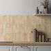 Zellij Arena Brick Moroccan Style 6.5cm x 20cm kitchen setting, brick-format tiles in warm sandy beige and soft golden tones, subtle tonal variation, glossy glazed finish, laid vertically as a kitchen splashback for a handcrafted Moroccan-inspired look.