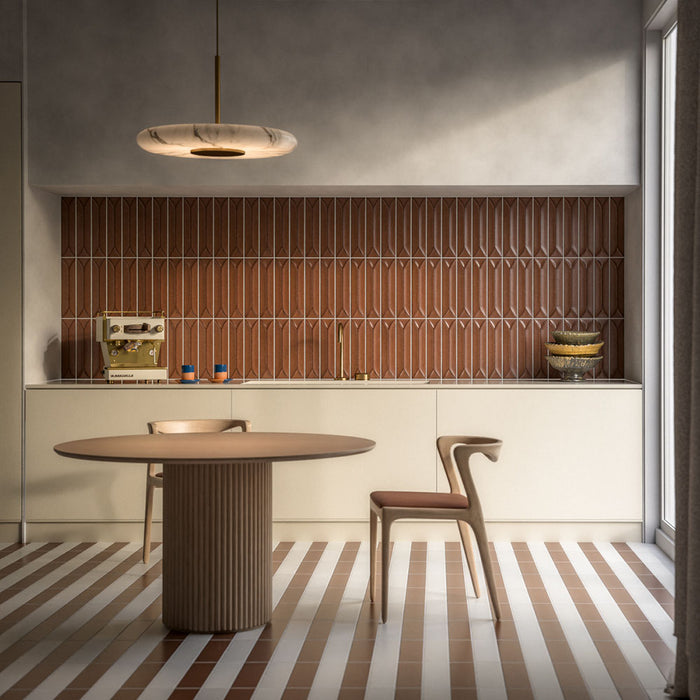 Kutani Cotto 9.1cm x 37.5cm porcelain tiles, bringing warm terracotta tones to the striped floor and creating a soft contrast against the neutral cabinetry and sculptural decor.