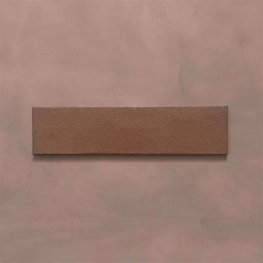 Single Kutani Cotto 9.1cm x 37.5cm porcelain wall and floor tile, featuring a warm terracotta-brown finish with subtle tonal variation and softly irregular edges.