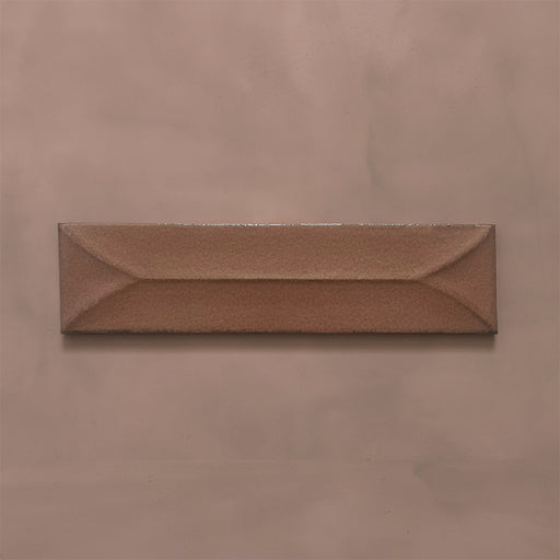 Single Kutani Decor Cotto 9.1cm x 37.5cm porcelain wall tile, featuring a warm terracotta-brown finish with raised geometric detailing, subtle tonal variation and softly irregular edges.