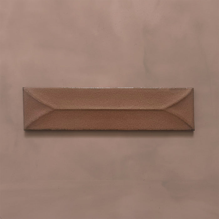 Single Kutani Decor Cotto 9.1cm x 37.5cm porcelain wall tile, featuring a warm terracotta-brown finish with raised geometric detailing, subtle tonal variation and softly irregular edges.
