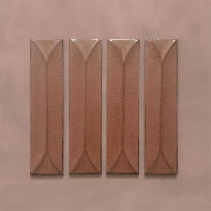 Kutani Decor Cotto 9.1cm x 37.5cm porcelain wall tile, featuring a warm terracotta-brown finish with raised geometric detailing, subtle tonal variation and softly irregular edges.
