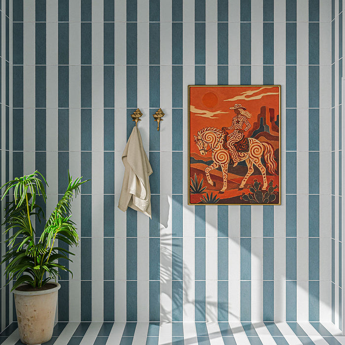 Kutani Vanilla 9.1cm x 37.5cm porcelain tiles, creating a bold vertical striped design alongside contrasting blue tiles, styled with warm-toned artwork, brass details and greenery.