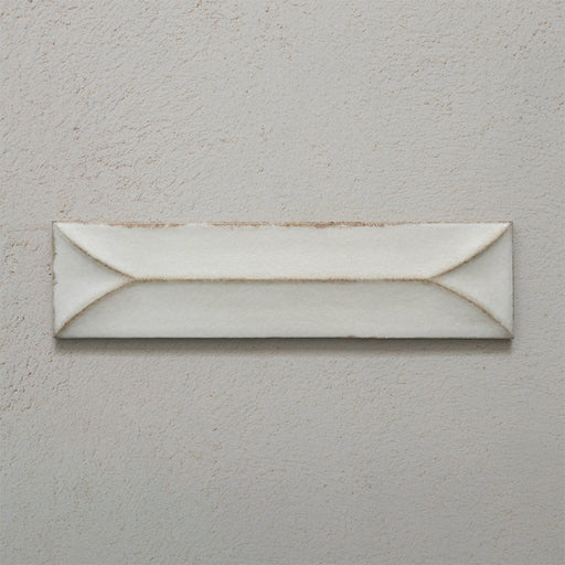 Single Kutani Decor Vanilla 9.1cm x 37.5cm porcelain wall tile, featuring a soft off-white finish with raised geometric detailing, subtle tonal variation and gently irregular edges.