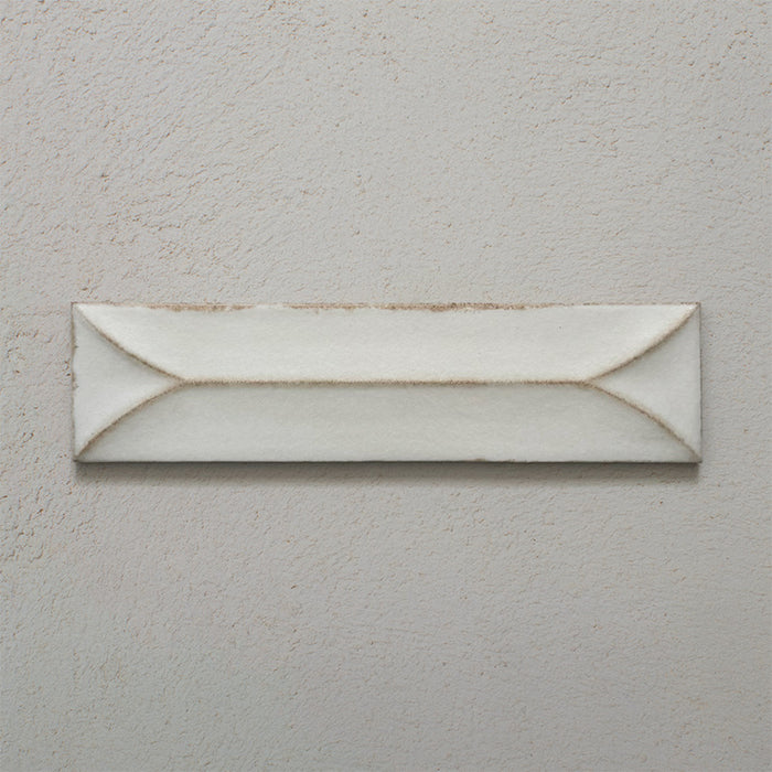Single Kutani Decor Vanilla 9.1cm x 37.5cm porcelain wall tile, featuring a soft off-white finish with raised geometric detailing, subtle tonal variation and gently irregular edges.