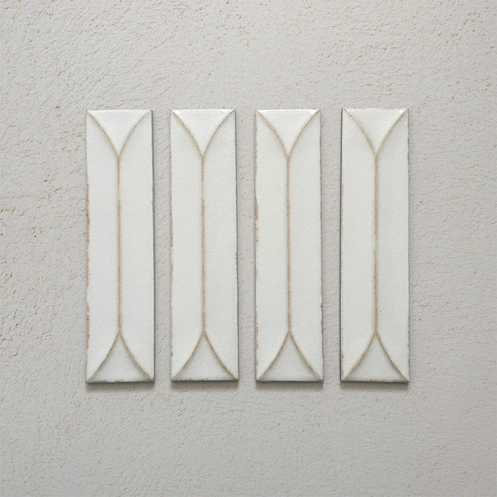 Kutani Decor Vanilla 9.1cm x 37.5cm porcelain wall tile, featuring a soft off-white finish with raised geometric detailing, subtle tonal variation and gently irregular edges.