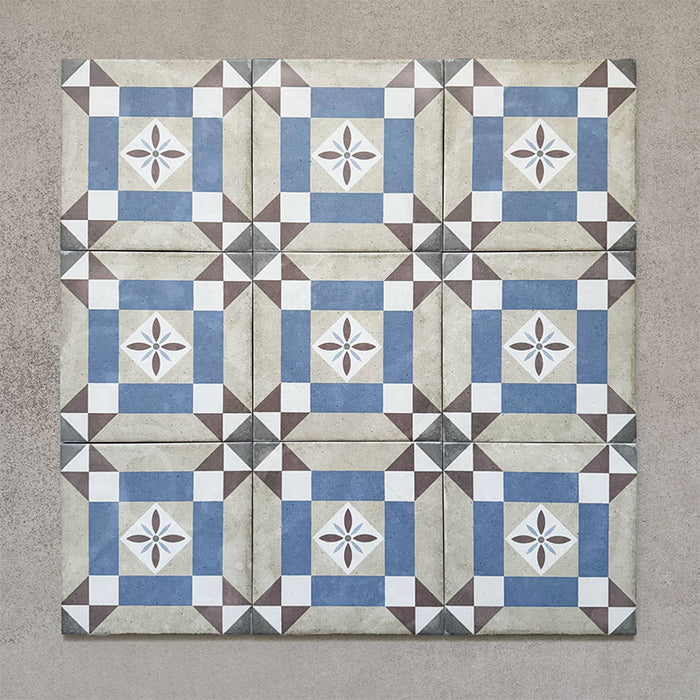 Grouped layout of Carnaby Lane Victorian-style 20x20cm porcelain wall and floor tiles, showing the full repeating blue and taupe geometric border design with central floral motifs on an aged neutral background.