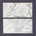 Close-up of Fitzrovia Lilac natural marble tiles in a honed finish, 30.5x61cm format, showcasing a soft white base with delicate lilac and grey veining, creating a subtle yet refined look for wall and floor applications.
