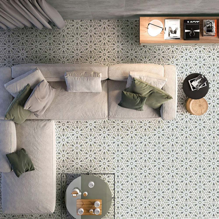 Maroush Mareshan Sage Green/Grey 18.7x21.6cm Moroccan hexagonal tiles with geometric white star patterns, styled in a modern living room with a beige sofa and green accents for a calm, elegant atmosphere.