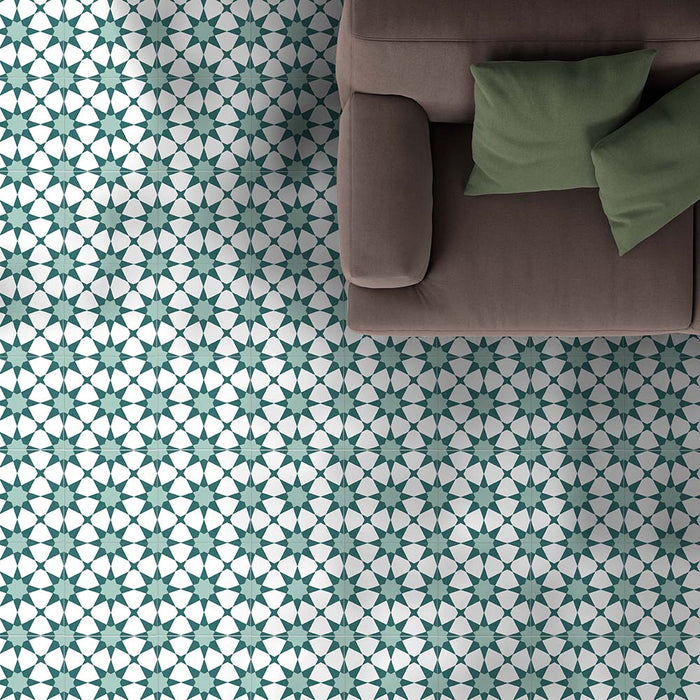 Living room featuring Agraba Green 20x20cm Moroccan-style ceramic floor tiles with a geometric star pattern in green and white, styled with a brown sofa and green cushions for a fresh, modern look.