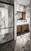 Bathroom interior featuring Maine Capraia Matt Marble 60 × 120cm porcelain wall tiles, showcasing a crisp white base with bold, dramatic grey veining, paired with black-framed shower detailing and warm wood cabinetry for a striking, contemporary contrast.