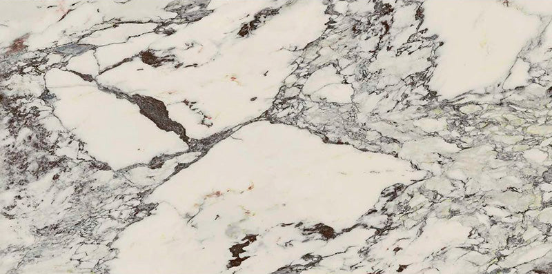 Flat lay of Maine Capraia Matt Marble 60 × 120cm porcelain tiles, showcasing a crisp white base with bold, sweeping grey veining and deeper tonal accents, creating a dramatic marble effect ideal for statement walls and floors.