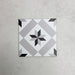 Georgetown Star Victorian-style 20x20cm patterned porcelain tile, featuring a classic black, white, and grey star motif with geometric detailing.