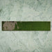 Single Malaga Tourmaline Green Brick 6.5 × 32.8cm gloss ceramic wall tile, showcasing rich green tonal variation, a reflective handcrafted-style finish, and softly weathered detailing for added depth and character.