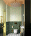 Bathroom interior featuring Maldives Pine Green 5 × 40cm gloss ceramic wall tiles, laid vertically across the lower walls with rich green tonal variation, paired with brass fittings, patterned floor tiles, and soft green panelling for a refined, layered look.